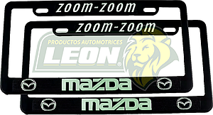 PORTAPLACAS NEGRAS GRABADAS MAZDA LETRAS FLUORESCENTES (JGO. c/2 pzas.)